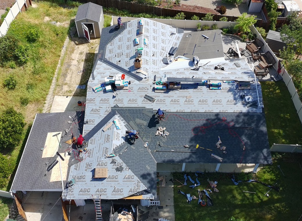 Affordable Roofing Systems crew installing underlayment during a Bay Area roof replacement