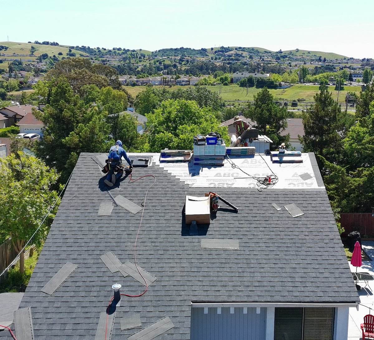 Affordable Roofing Systems crew installing a roof on a sunny day in the Bay Area