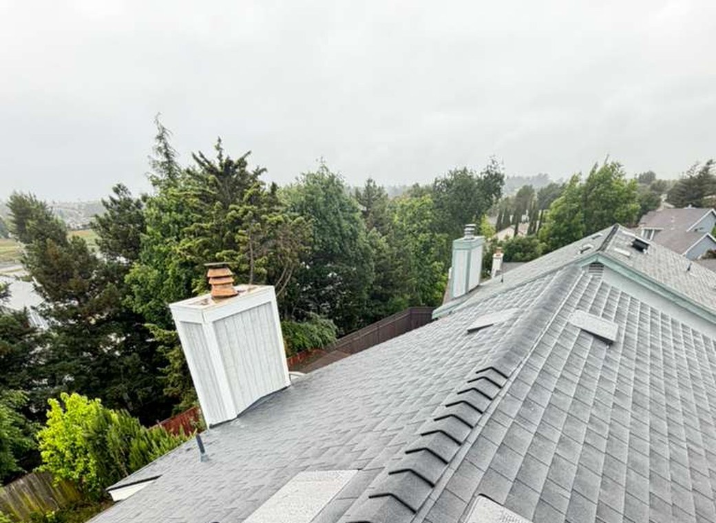 Completed Bay Area roof replacement by Affordable Roofing Systems on a rainy day
