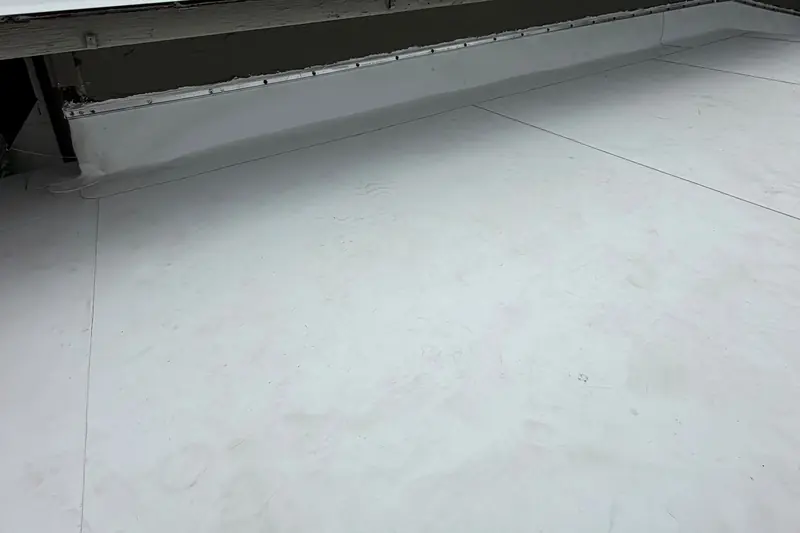Finished white TPO flat roof with a termination bar on a home in Pacheco, CA